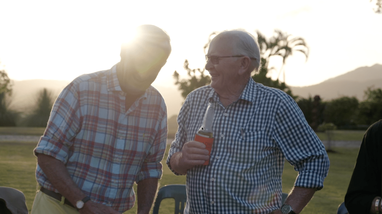 Seniors enjoying vibrant health outdoors at sunset Alt text: Two older men relax at sunset; the man on the right, smiling with a drink, radiates vitality after Bioelectric Meridian Therapy. Description: Sharing laughter at dusk, two seniors demonstrate wellbeing and ease inspired by Bioelectric Meridian Therapy sessions.